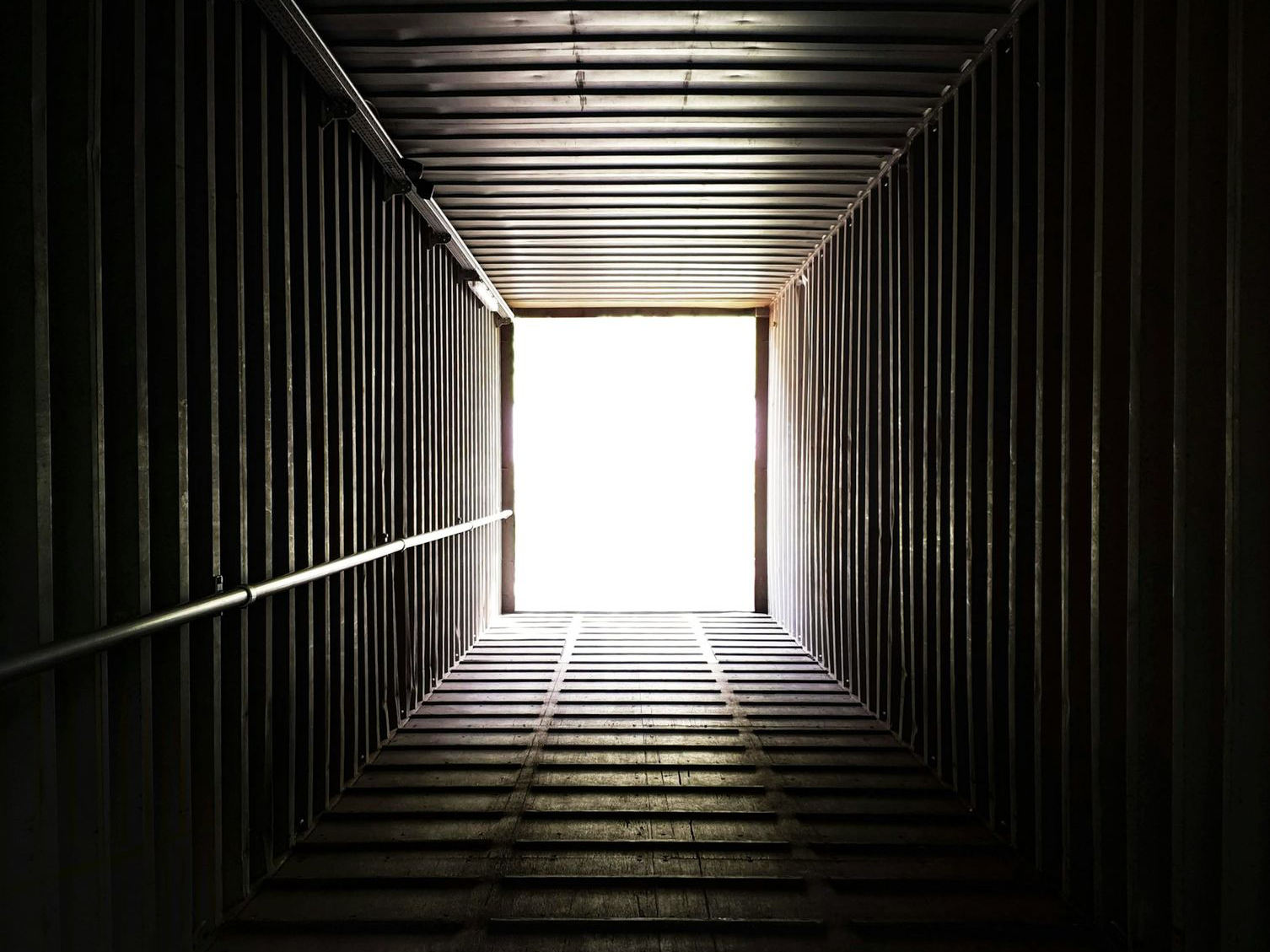 a dark tunnel with a light at the end